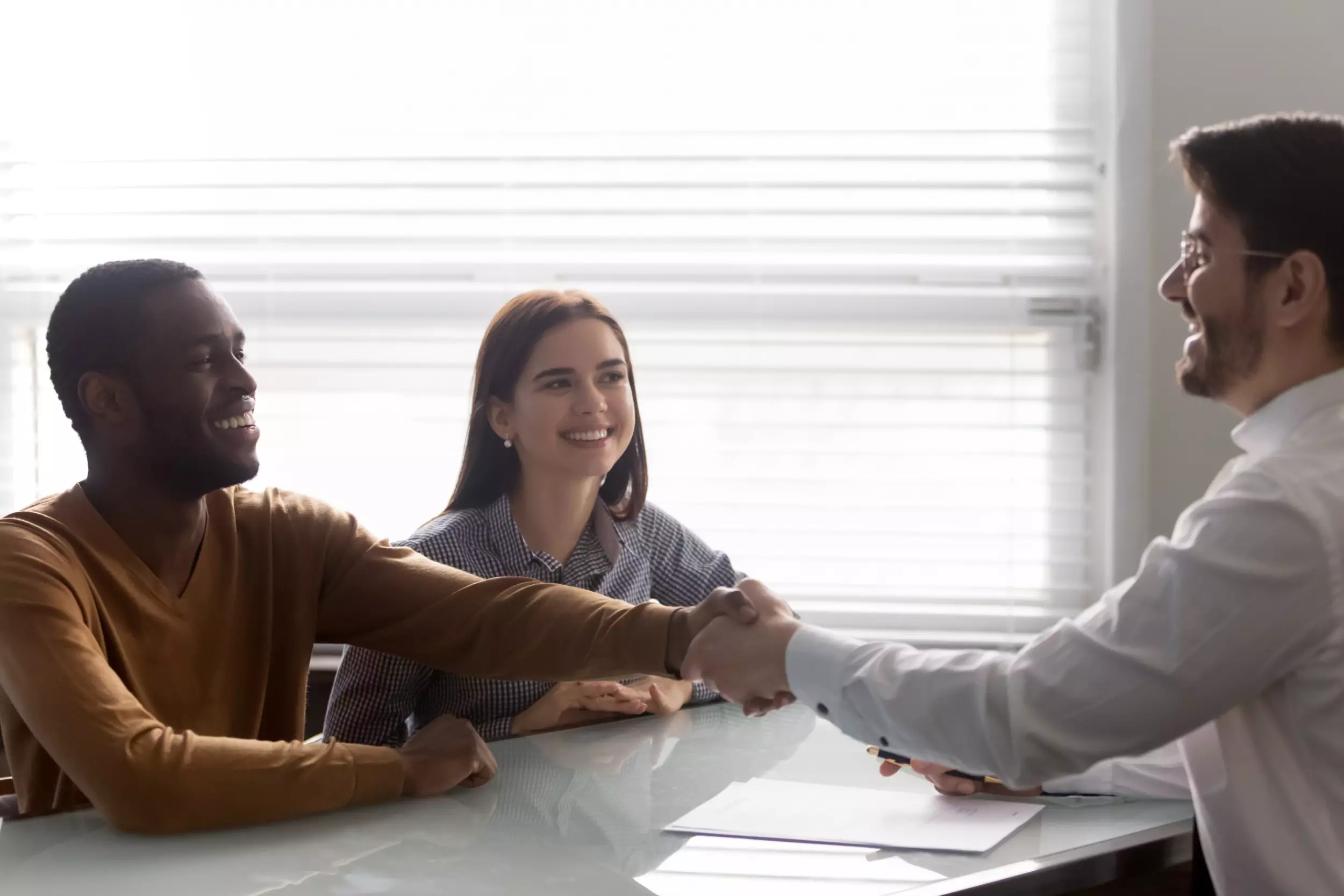 A young couple meeting with a lender